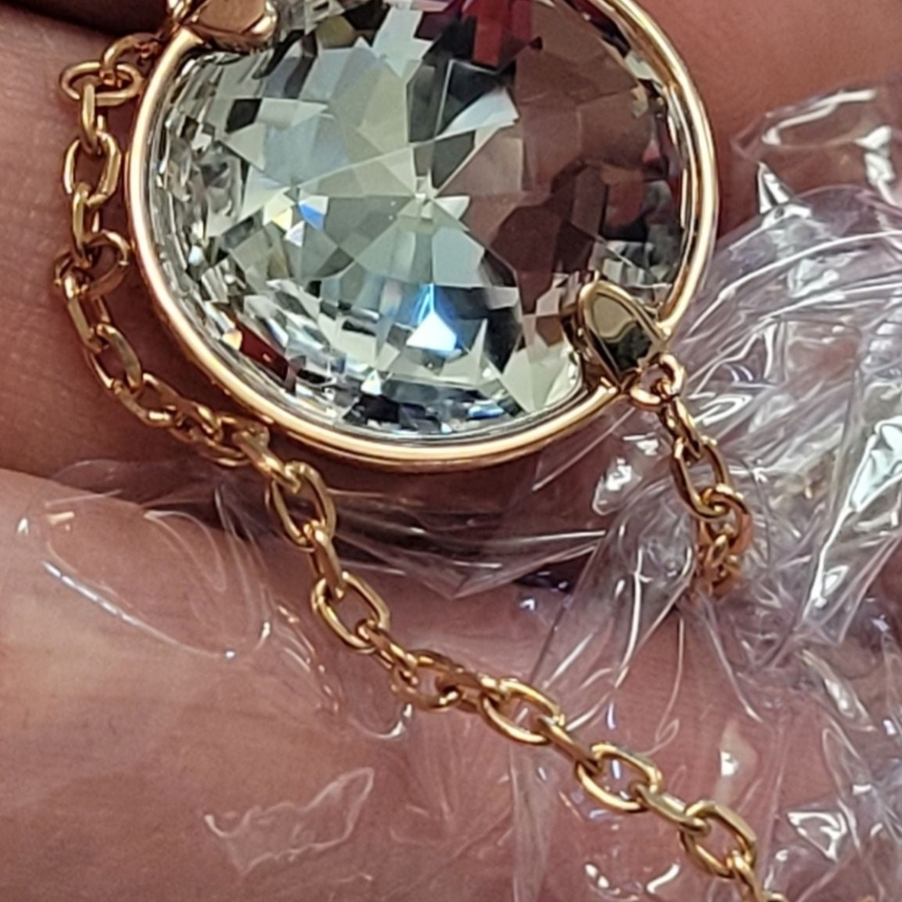 Swarovski rose gold-plated strandage necklace adorned Globe clear crystals